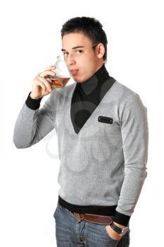 Royalty Free Photo of a Young Man Drinking Whiskey