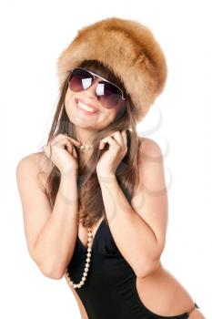 Royalty Free Photo of a Woman in a Fur Hat and Black Swimsuit