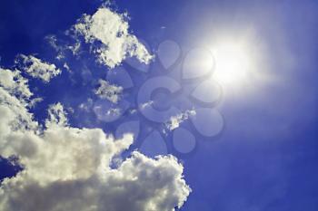 Royalty Free Photo of the Sky, Sun and Clouds