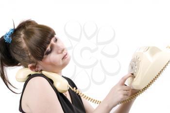 Royalty Free Photo of a Woman Dialing a Rotary Phone