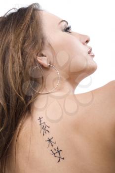 Royalty Free Photo of a Tattoo on a Woman's Back
