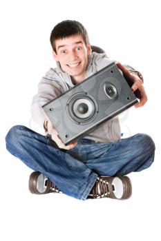 Royalty Free Photo of a Boy With a Speaker in His Hands