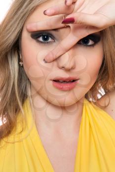 Royalty Free Photo of a Woman Forming a V Around Her Eye With Her Fingers