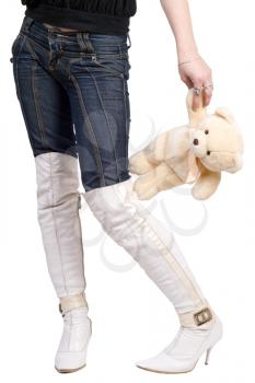 Royalty Free Photo of a The Bottom Half of a Woman Who is Holding a Teddy Bear