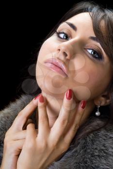 Royalty Free Photo of a Woman With Her Hands at Her Face