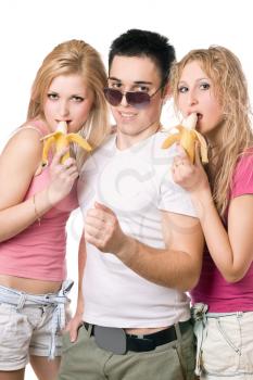 Royalty Free Photo of Two Girls and a Boy Eating Bananas