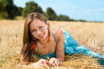 Royalty Free Photo of a Young Woman Lying in a Field