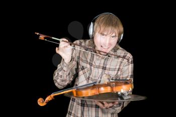 Royalty Free Photo of a Man Wearing Headphones Licking a Violin BOw