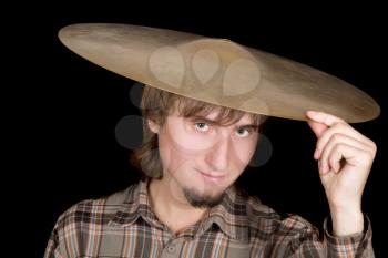 Royalty Free Photo of a Man With a Cymbal on His Head