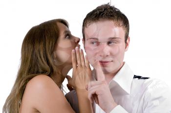 Royalty Free Photo of a Woman Whispering in a Man's Ear