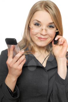 Royalty Free Photo of a Woman With Two Cellphones