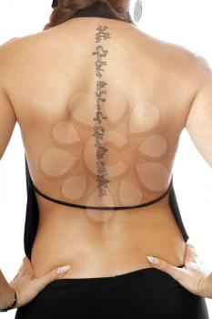 Royalty Free Photo of a Tattoo on a Woman's Back
