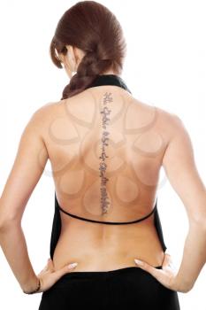 Royalty Free Photo of a Woman With a Tattoo on Her Back