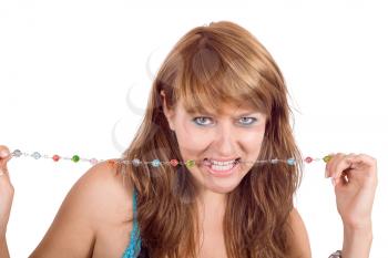 Royalty Free Photo of a Young Woman With Beads in Her Teeth