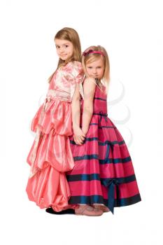 Two beautiful little girls in a long dress