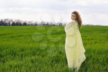 Nice young woman wrapped in yellow cloth