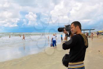 Man photographer takes shot at stormy sea
