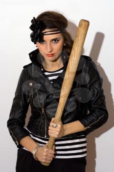 Pretty young woman with a bat in their hands