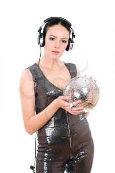 Attractive young woman in headphones with a mirror ball. Isolated on white