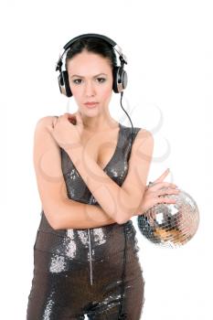 Attractive young woman in headphones with a mirror ball. Isolated