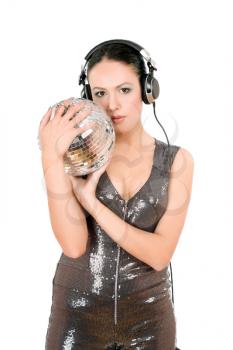 Sexy young woman in headphones with a mirror ball. Isolated