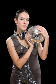 Portrait of nice woman with a mirror ball in her hands. Isolated on black
