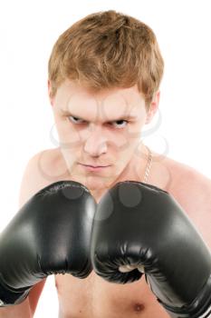 Angry young man in boxing gloves. Isolated on white