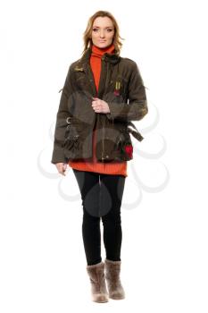 Young woman in jacket and orange sweater. Isolated