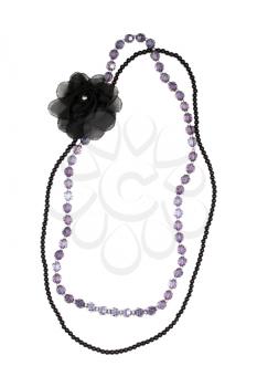 Black and purple beads on white background