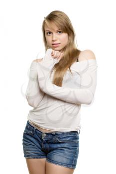 Young blond caucasian woman wearing blue shorts and white blouse. Isolated
