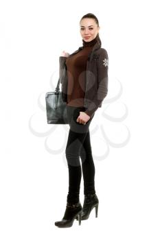 Attractive young woman with a bag wearing black pants and shoes. Isolated on white  