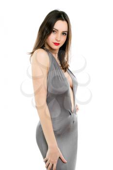 Alluring young lady wearing sexy grey dress. Isolated on white