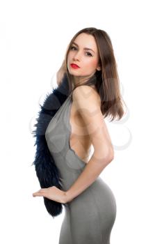 Sexy slim brunette posing in grey dress with fur. Isolated on white