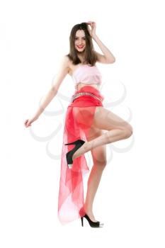 Graceful young lady showing her unusual red skirt. Isolated on white
