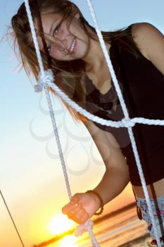 Portrait of the smiling teen girl at sunset