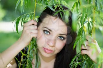 Attractive caucasian woman posing in the branches