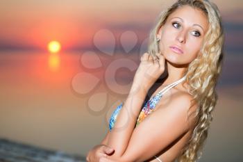 Portrait of thoughtful blond woman at the sunset