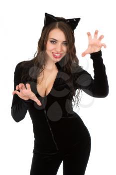 Playful woman dressed in catsuit and showing her teeth. Isolated on white