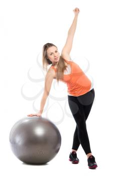 Attractive young woman exercising with a fit. Isolated on white