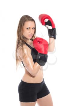 Portrait of pretty blonde posing with red boxing gloves. Isolated on white