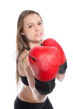 Young blonde demonstrating red boxing gloves. Isolated on white