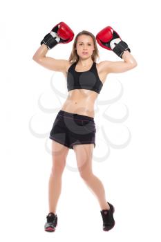 Young woman posing with big red boxing gloves. Isolated on white