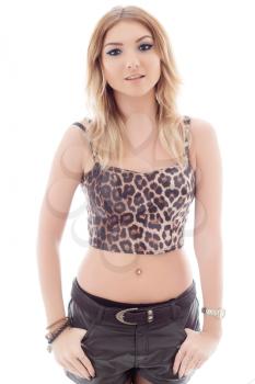 Portrait of young woman wearing leopard top and leather shorts. Isolated on white