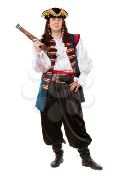 Young man in pirate costume posing with a pistol. Isolated on white