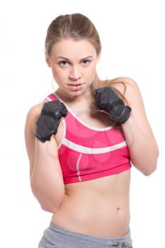 Portrait of young blonde posing in sport clothes. Isolated on white