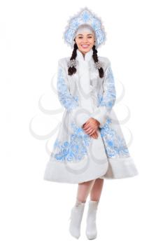 Nice brunette posing in a snow maiden costume. Isolated on white