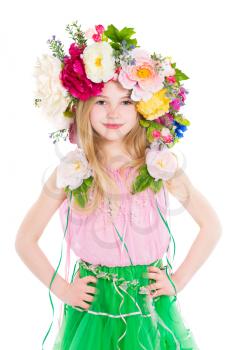 Portrait of little girl posing with a wreath on her head. Isolated