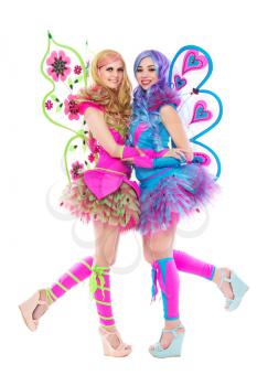 Two cheerful women wearing colorful butterfly costumes. Isolated on white