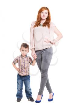 Young redhead woman posing with her little son. Isolated on white