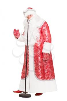 Man in Santa Claus suit posing with microphone. Isolated on white